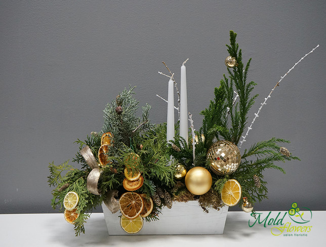 Table Composition with Christmas Tree and Golden Ornaments photo